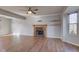 Spacious living room featuring a fireplace, floating shelves and wood laminate flooring at 917 Claiborne Ln, Lebanon, IN 46052