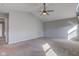 This main bedroom has neutral walls, a ceiling fan and wall to wall carpet at 917 Claiborne Ln, Lebanon, IN 46052