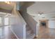 Staircase with carpeted steps leading to the second floor with living area visible at the top at 917 Claiborne Ln, Lebanon, IN 46052