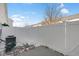 Private fenced-in backyard with a concrete patio and some snow on the ground at 9730 Prairie Smoke Dr, Noblesville, IN 46060