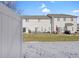 A view of a home's backyard with a privacy fence and ample space for entertaining at 9730 Prairie Smoke Dr, Noblesville, IN 46060