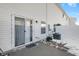 Backyard with an outdoor patio space, sliding glass doors, and a white privacy fence at 9730 Prairie Smoke Dr, Noblesville, IN 46060