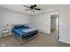 Bedroom featuring neutral walls and carpet, a bed, and a doorway leading to the hallway at 9730 Prairie Smoke Dr, Noblesville, IN 46060