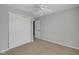Bedroom features neutral walls, carpeting, a ceiling fan, and closets at 9730 Prairie Smoke Dr, Noblesville, IN 46060