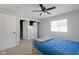 Bedroom featuring carpet, a bed, a closet, and a window letting in natural light at 9730 Prairie Smoke Dr, Noblesville, IN 46060