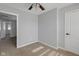 Bedroom features neutral walls and carpeting with a ceiling fan at 9730 Prairie Smoke Dr, Noblesville, IN 46060