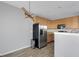 Kitchen with stainless steel appliances, wooden cabinets, and modern lighting at 9730 Prairie Smoke Dr, Noblesville, IN 46060