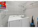 Well-equipped laundry room with new washer and dryer and storage at 9730 Prairie Smoke Dr, Noblesville, IN 46060