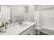 The bathroom features sleek fixtures, a shower with curtain, and a pristine countertop for a spa-like feel at 1004 Astor Ln, Carmel, IN 46032