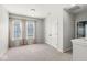 Carpeted bedroom with natural light and closet space; interior doors painted light gray at 1004 Astor Ln, Carmel, IN 46032