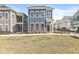 Beautiful two-story blue home with a well-maintained lawn and classic architecture in a residential neighborhood at 1004 Astor Ln, Carmel, IN 46032