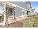 Charming townhouse with a blue exterior, brick foundation, and welcoming front entrance at 1004 Astor Ln, Carmel, IN 46032