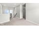 Bright hallway landing with neutral carpeting and access to various rooms at 1004 Astor Ln, Carmel, IN 46032