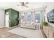 Inviting living room features a comfortable sofa, stylish decor, and ample natural light from large windows at 1004 Astor Ln, Carmel, IN 46032