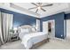 This primary bedroom offers a big bed and a walk-in closet for maximum storage and organization at 1004 Astor Ln, Carmel, IN 46032
