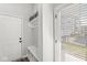 Cozy mudroom with a bench, hooks, and storage shelves for organization and convenience at 1004 Astor Ln, Carmel, IN 46032