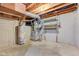 Unfinished basement featuring a water heater, a furnace and other utilities at 10046 Gate Dr, Indianapolis, IN 46239