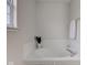 Bright bathroom featuring a soaking tub with tile surround at 10046 Gate Dr, Indianapolis, IN 46239