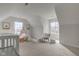 This Bedroom features neutral carpet, a white crib, and fun decor at 10046 Gate Dr, Indianapolis, IN 46239