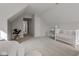 This bedroom features neutral carpet and a peaked ceiling at 10046 Gate Dr, Indianapolis, IN 46239
