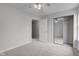 This bedroom features neutral carpet and a mirrored closet at 10046 Gate Dr, Indianapolis, IN 46239