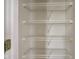 A closet with shelves in the interior space at 10046 Gate Dr, Indianapolis, IN 46239