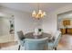 A dining room that features a table, chandelier, and hardwood floors at 10046 Gate Dr, Indianapolis, IN 46239