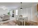 The dining area is situated adjacent to a cozy living room with a fireplace at 10046 Gate Dr, Indianapolis, IN 46239
