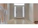 Inviting foyer with tile flooring, white trim, and a glimpse of natural light at 10046 Gate Dr, Indianapolis, IN 46239