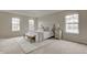 Spacious main bedroom with soft carpet and bright windows at 10046 Gate Dr, Indianapolis, IN 46239