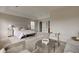 Spacious main bedroom with a sitting area and calming neutral color palette at 10046 Gate Dr, Indianapolis, IN 46239