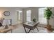 Bright and airy office space with natural light, desk, and views of the entryway at 10046 Gate Dr, Indianapolis, IN 46239