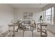Sitting area with a comfortable gray sofa, two chairs and plenty of natural light at 10046 Gate Dr, Indianapolis, IN 46239