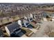 An aerial view shows a well-maintained neighborhood with mature trees and manicured lawns at 10725 Chenille Ct, Indianapolis, IN 46235
