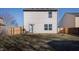 Home backyard with a grill, fenced yard, and an exterior door to the home at 10725 Chenille Ct, Indianapolis, IN 46235
