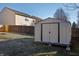 A durable outdoor shed offers extra storage space, within the fenced backyard at 10725 Chenille Ct, Indianapolis, IN 46235