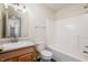 Bathroom featuring a tub-shower, wood-look vanity and neutral color scheme at 10725 Chenille Ct, Indianapolis, IN 46235