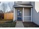 Close-up of the front door with white trim and a small porch at 10725 Chenille Ct, Indianapolis, IN 46235