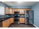Updated kitchen with stainless steel appliances, ample wood cabinets and tile backsplash at 10725 Chenille Ct, Indianapolis, IN 46235