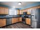 Updated kitchen featuring stainless steel appliances and light wood cabinets and granite countertops at 10725 Chenille Ct, Indianapolis, IN 46235