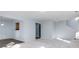Open-concept living room with carpet, light walls, and seamless flow to other spaces at 10725 Chenille Ct, Indianapolis, IN 46235