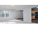 Bright living room with large windows, white walls, and plush carpet at 10725 Chenille Ct, Indianapolis, IN 46235