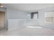 Open and airy loft space with neutral paint and plush carpeting at 10725 Chenille Ct, Indianapolis, IN 46235