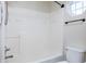 Shower and tub combo features an adjustable shower head and built-in shelving at 10725 Chenille Ct, Indianapolis, IN 46235