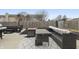 Outdoor patio with a gray patio set, and a covered grill area at 12486 Schoolhouse Rd, Fishers, IN 46037