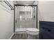 Updated bathroom featuring a glass-enclosed shower with a black frame at 12486 Schoolhouse Rd, Fishers, IN 46037