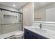 Modern bathroom with glass shower and sleek vanity with a lighted mirror at 12486 Schoolhouse Rd, Fishers, IN 46037
