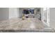 Kitchen featuring stylish countertops with open view to living room at 12486 Schoolhouse Rd, Fishers, IN 46037