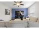 Cozy living room featuring a comfortable couch and mounted television at 12486 Schoolhouse Rd, Fishers, IN 46037