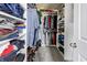 Walk-in closet with shelving and hanging rods for organization at 12486 Schoolhouse Rd, Fishers, IN 46037